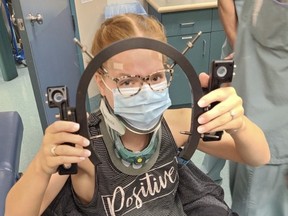 Brianna Seewald holds part of her halo neck stabilizer that she wore for months following a severe car wreck in August 2020. 
Photo submitted by Brianna Seewald