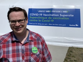 Winnipeg Sun columnist Josh Aldrich poses after getting his first Pfizer dose on Monday, May 17, 2021 at the Leila Avenue Super Site in Winnipeg.