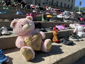 A memorial on the footsteps of the Manitoba Legislature in Winnipeg on Monday, May 31, 2021, to remember the 215 children whose bodies were found in an unmarked grave at the Kamloops Indian Residential School in Kamloops, B.C.