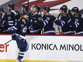 Winnipeg Jets left wing Kyle Connor celebrates his first-period goal against the Vancouver Canucks on Tuesday.