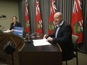Dr. Brent Roussin, chief provincial public health officer, right, and Health and Seniors Care Minister Heather Stefanson announce new COVID-19 restrictions for the long weekend at a press conference at the Manitoba Legislature in Winnipeg Thursday, May 20, 2021. 
JOHN WOODS/POOL/WINNIPEG FREE PRESS