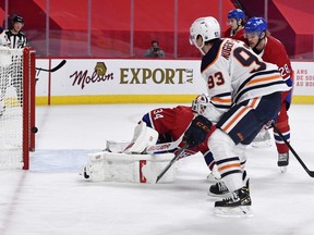 Edmonton Oilers forward Ryan Nugent-Hopkins (93) scores a goal against Montreal Canadiens goalie Jake Allen (34) during the first period at the Bell Centre.