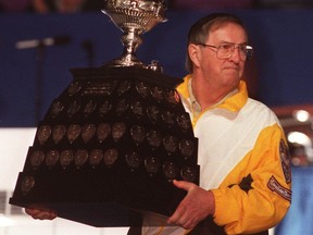 Manitoba skip Barry Fry walks in with refurbished Brier Tankard Trophy at the opening ceremony to the 2001 Brier at the Ottawa Civic Centre on Saturday March 3, 2001. Fry was the winner of the 1979 MacDonald Brier.