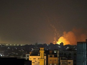 Smoke and flame rise as hostilities between Israel and Hamas escalate, in Gaza May 13, 2021.