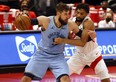 Memphis Grizzlies centre Jonas Valanciunas drives to the basket against Toronto Raptors centre Khem Birch on Saturday.