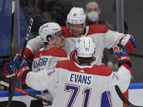 Montreal Canadiens forward Brendan Gallagher (11) celebrates with forward Eric Staal (21) and forward Jake Evans (71) after scoring against the Toronto Maple Leafs in game seven of the first round of the 2021 Stanley Cup Playoffs at Scotiabank Arena.  Dan Hamilton-USA TODAY Sports