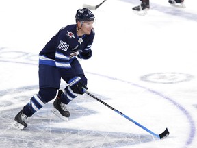 Winnipeg Jets center Paul Stastny (25) wears a commemorative jersey to celebrate his 1,000th game before the game against the Vancouver Canucks at Bell MTS Place in Winnipeg on Tuesday, May 11, 2021.