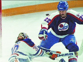 Edmonton Oilers goalie Bill Ranford makes a point blank toe save off of Winnipeg Jets Moe Mantha during Game 2 of the Smythe Division semifinals at Northlands Coliseum in Edmonton, Alta., on April 6, 1990. The Oilers went on to win the series in seven games. The Oilers would go on to beat the Boston Bruins in five games to win their fifth cup. Tom Braid/Edmonton Sun/QMI Agency