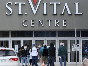 People line up to enter a shopping centre in Winnipeg.   Tuesday, May 04, 2/2021.Winnipeg Sun/Chris Procaylo/stf