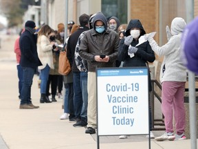 People line up for drop-in spots at the Urban Indigenous Vaccination Centre, run by Ma Mawi Wi Chi Itata Centre, at Win Gardner Place on McGregor Street in Winnipeg on Monday, May 3, 2021. The site is also offering drop-in spots on Tuesday from 10:30 a.m.-4:30 p.m. and is administering the Moderna vaccine.