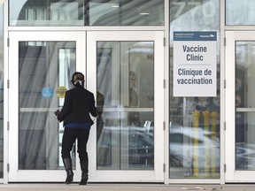 An official enters the new provincial COVID-19 vaccination supersite at Winnipeg Soccer Federation Complex North on Leila Avenue, slated to open Friday, in Winnipeg on Thursday.