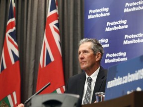 Premier Brian Pallister listens during a press briefing at the Manitoba Legislative Building in Winnipeg on Monday, May 10, 2021.