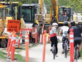 Cyclists use a path as road construction work continues on Wellington Crescent in Winnipeg on Wed., May 19, 2021. KEVIN KING/Winnipeg Sun/Postmedia Network