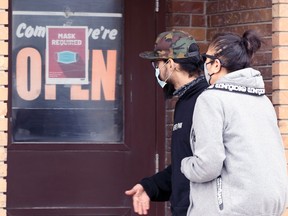 People enter a restaurant on Isabel Street in Winnipeg on Thursday, May 20, 2021.