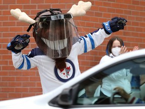 Winnipeg Jets mascot Mick E. Moose and others took part in a honk parade outside Bell MTS Place before the Jets faced the Edmonton Oilers in Game 3 of its Stanley Cup playoff series in Winnipeg on Sunday, May 23, 2021.