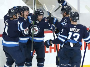 Winnipeg Jets forward Nikolaj Ehlers (second from left) celebrates his goal against the Edmonton Oilers in Game 3 of a Stanley Cup playoff series in Winnipeg with Neal Pionk, Mathieu Perreault, Andrew Copp and Pierre-Luc Dubois (from left) on Sunday.