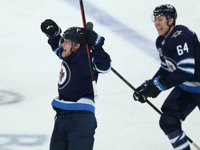 Winnipeg Jets forward Nikolaj Ehlers (left) celebrates his overtime goal against the Edmonton Oilers in Game 3 of a Stanley Cup playoff series in Winnipeg on Sunday.