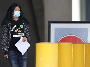 A person walks outside the COVID-19 vaccination clinic at RBC Convention Centre in Winnipeg on Wednesday, May 26, 2021.