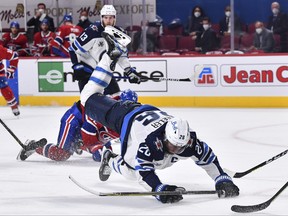 Winnipeg Jets' Blake Wheeler falls to the ice against the Montreal Canadiens on Sunday night.
