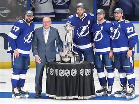 NHL deputy commissioner Bill Daly presents Alex Killorn, Ryan McDonagh, Victor Hedman and Steven Stamkos of the Tampa Bay Lightning with the Prince of Wales Trophy.