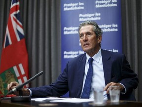 Premier Brian Pallister and Manny Atwal, president and CEO, Manitoba Liquor and Lotteries, during a vaccine incentive announcement Wednesday morning. The province will be offering nearly $2 million in cash and scholarships to encourage more Manitobans to get the shot this summer.
Mike Deal/Pool/Winnipeg Free Press