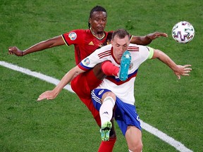 Belgium's Dedryck Boyata in action with Russia's Artem Dzyuba during Euro 2020 action June 12, 2021, at Gazprom Arena in Saint Petersburg, Russia.