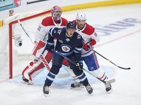 Jets forward Andrew Copp sets up in front of the Montreal Canadiens' net during Game 2 of their playoff series, from which Winnipeg was swept. Copp can become a restricted free agent this summer.