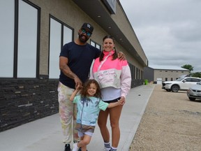Sean Stewart, Chryslin Friesen, seen here with their son Sunshine at the site at 555 Traverse Rd. in Ste. Anne, where they plan to open AAAAA Supercraft Cannabis on June 25. Dave Baxter/Postmedia