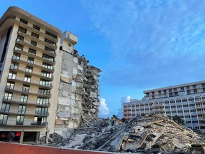 This handout image courtesy of the Miami-Dade Fire Rescue shows the partially collapsed building in Surfside, north of Miami Beach, Fla. on Friday, June 25, 2021.