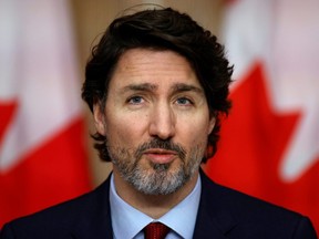 Prime Minister Justin Trudeau takes part in a news conference in Ottawa February 19, 2021.