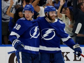 Lightning forward Ondrej Palat, left, celebrates with Brayden Point after scoring a goal against the Islanders during the second period in Game 2 of the Stanley Cup Semifinals at Amalie Arena in Tampa, Fla., Tuesday, June 15, 2021.