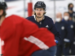 Winnipeg Jets centre Mark Scheifele, on the ice at an optional practice, on Wed., June 2, 2021, won't be able to play until Game 6 of their series against the Canadiens.