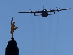 435 Transport and Rescue Squadron flew a Royal Canadian Air Force CC-130 Hercules past the Manitoba Legislature, in Winnipeg, in a show of empathy and support for Indigenous Peoples on Thursday. Chris Procaylo/Winnipeg Sun