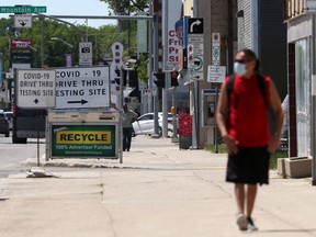 Foot traffic and Covid-19 test site signs, in Winnipeg.   Thursday, June 3, 2/2021.Winnipeg Sun/Chris Procaylo/stf