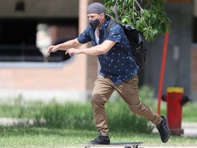 A person wears a mask while skateboarding in Winnipeg on Friday, June 11, 2021.