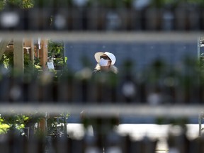 A woman wears a mask while shopping in a south Winnipeg garden centre on Tues., June 15, 2021. KEVIN KING/Winnipeg Sun/Postmedia Network