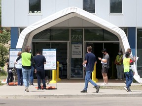 People line up outside thevaccination clinic at 770 Leila Avenue, in Winnipeg on Tuesday. Chris Procaylo/Winnipeg Sun
