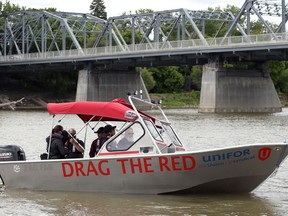 Drag The Red launches its 2021 search for missing and murdered peoples with a new boat donated by Unifor on the Red River near the Redwood Bridge in Winnipeg on Monday, June 21, 2021.