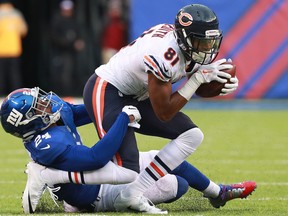 Eli Apple (24) of the New York Giants tackles Cameron Meredith (81) of the Chicago Bears during the second half at MetLife Stadium on Nov. 20, 2016 in East Rutherford, New Jersey.