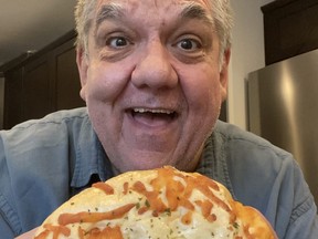 Columnist Hal Anderson gets ready to enjoy one of the over 30 different buns to choose from Ming's Bakery at 1433 Logan Ave. in Winnipeg's West End. Ming's Bakery will reopen on July 21st.