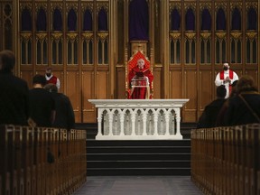 Cardinal Thomas Collins of the Roman Catholic Archdiocese of Toronto delivers the Good Friday liturgy at St. Michael's Cathedral Basilica.
