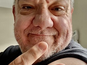 Winnipeg Sun columnist Hal Anderson shows off his Band-Aid after receiving his second dose of COVID-19 vaccine recently.