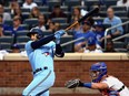 Toronto Blue Jays centr- fielder George Springer hits a solo home run against the New York Mets during the third inning at Citi Field in New York City, July 24, 2021.