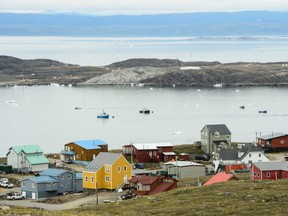 Small boats make their way through the Frobisher Bay inlet in Iqaluit in Aug. 2019.