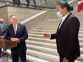 CP-Web.  Alan Lagimodiere, left, Manitoba's minister for Indigenous reconciliation and northern relations, is confronted by Opposition NDP Leader Wab Kinew, right, shortly after being sworn in to cabinet at the Manitoba legislature in Winnipeg on Thursday, July 15, 2021.