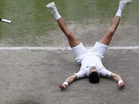 Serbia's Novak Djokovic celebrates winning his Wimbledon match against Italy's Matteo Berrettini at the All England Lawn Tennis and Croquet Club in London, July 11, 2021.