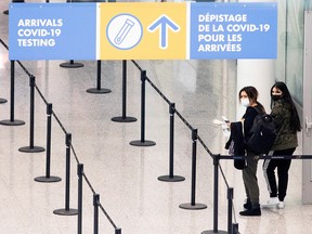 Passengers arrive at Toronto's Pearson Airport after mandatory coronavirus testing took effect for international arrivals in Mississauga February 1, 2021.