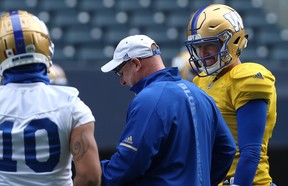 Quarterback Matt Nichols shares a laugh with offensive co-ordinator Paul LaPolice during their Winnipeg days together. The two have been re-united in Ottawa this coming season.
