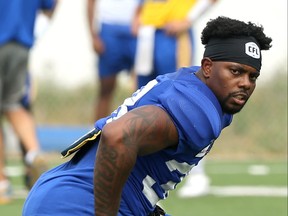 Defensive back Alden Darby stretches during Winnipeg Blue Bombers practice on the University of Manitoba campus on Wednesday.