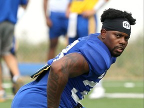 Defensive back Alden Darby stretches during Winnipeg Blue Bombers practice on the University of Manitoba campus on Wednesday, July 21, 2021.